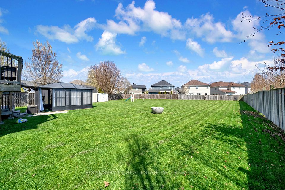 Massive backyard, view of solarium and Sheds.