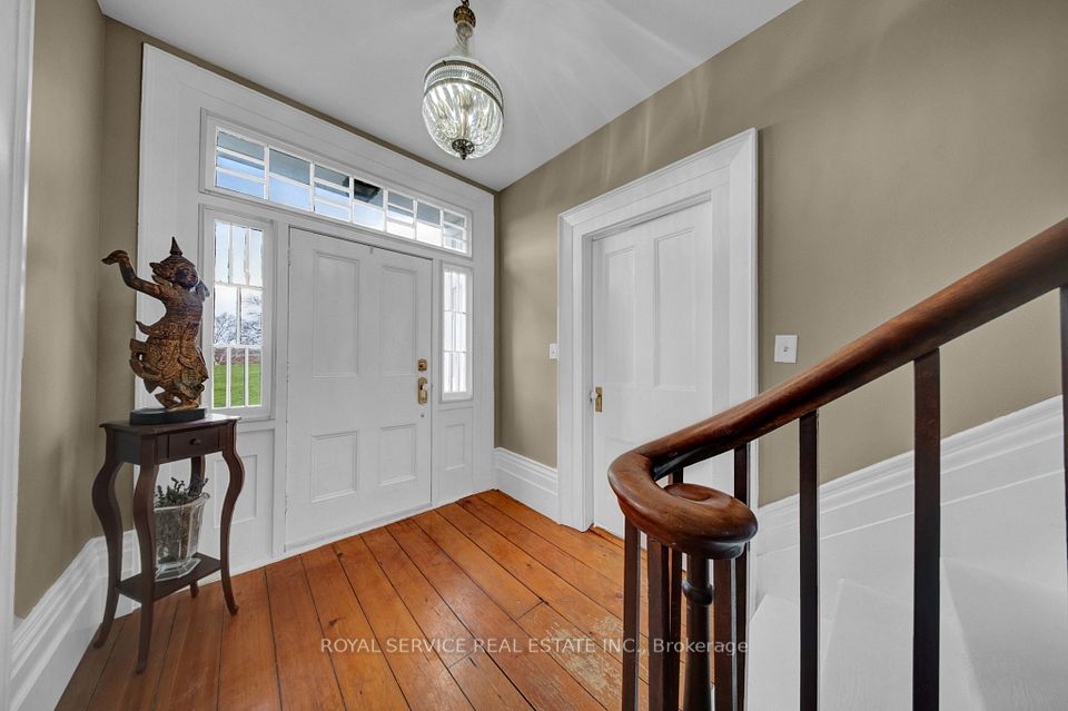 Front Foyer Original Wood Plank Floors & Bannister