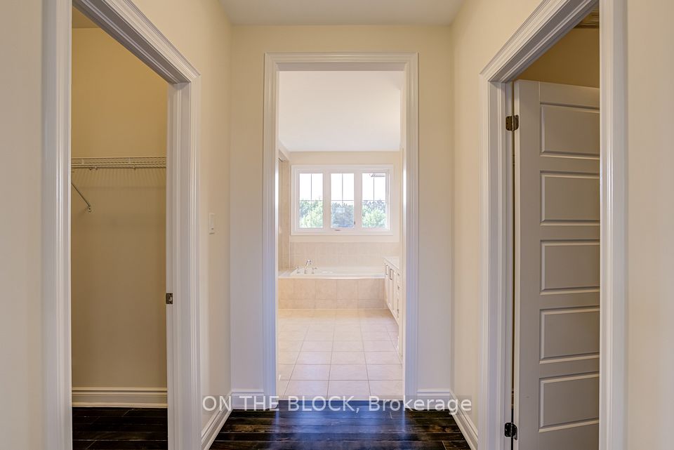 Primary Bedroom His & Her Walk-in Closet