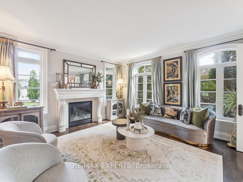 Family Room , Fireplace ,Large Windows, Moldings!