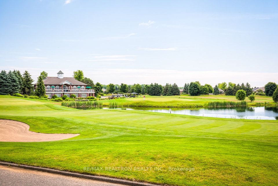 18th Hole With Views Of Pond and Club House