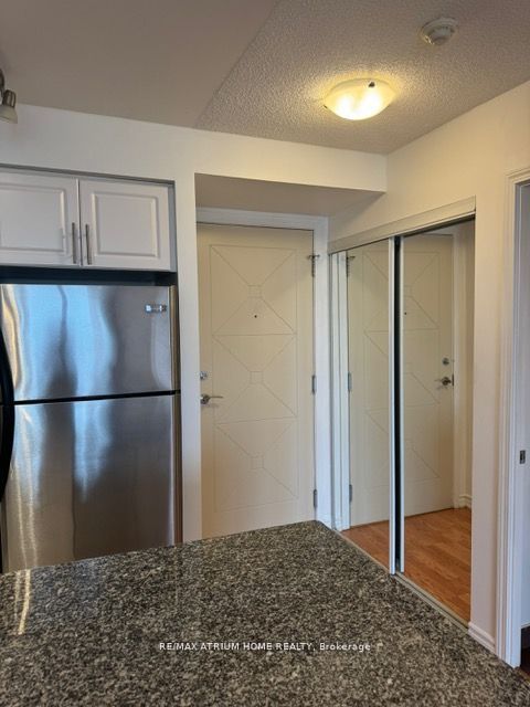 Mirrored Closet In Foyer