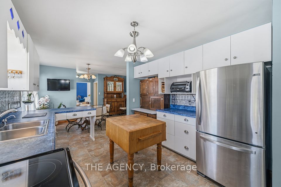 Open-concept kitchen combined w/ dining