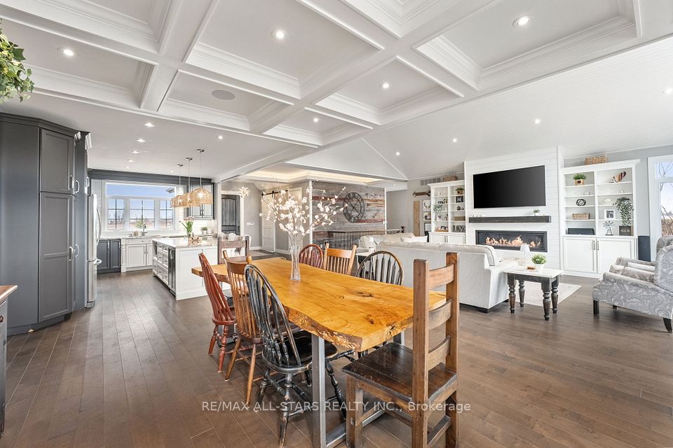 Open concept dining area with coffered ceilings
