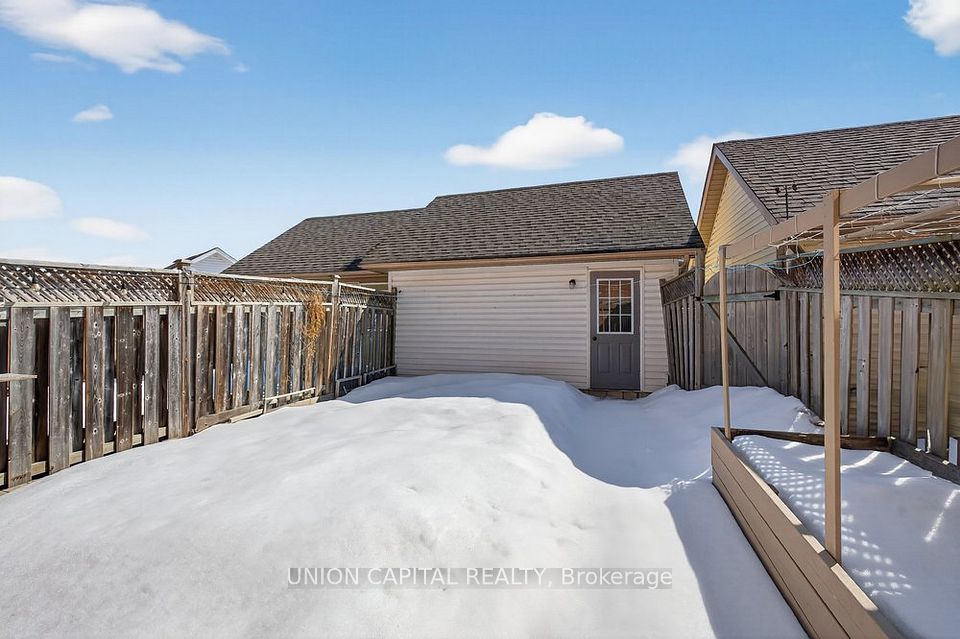 DETACHED DOUBLE CAR GARAGE + 1 PARKING ON PAD