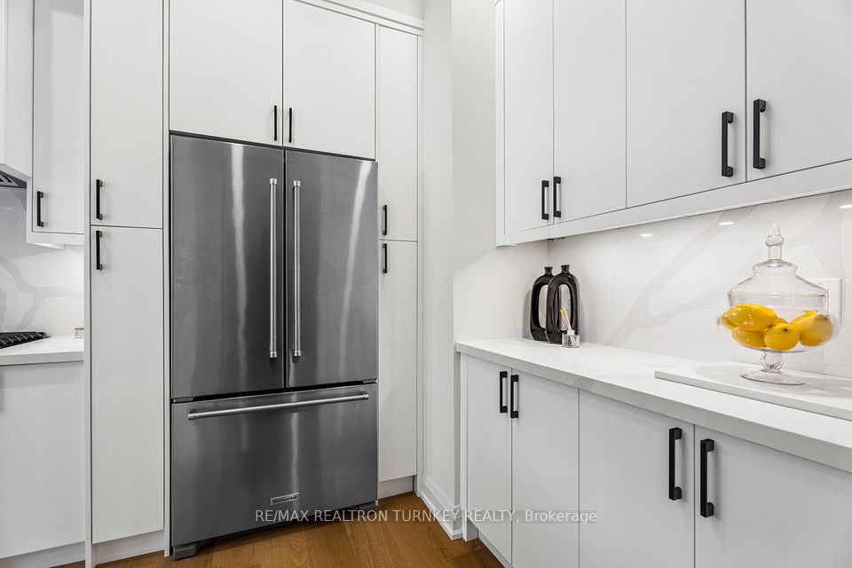 Stainless steel fridge w lots of storage in pantry