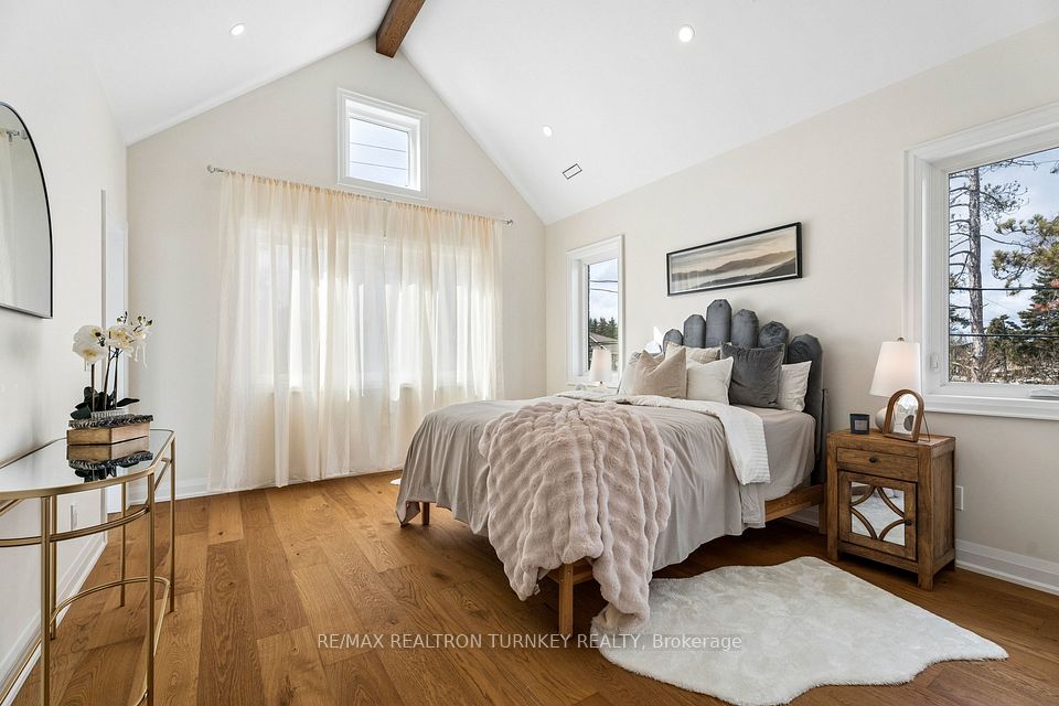 Primary retreat features a vaulted beam ceiling