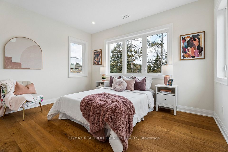 Third bedroom with large 3 panel window