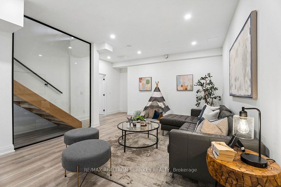 A separate rec room w modern glass feature