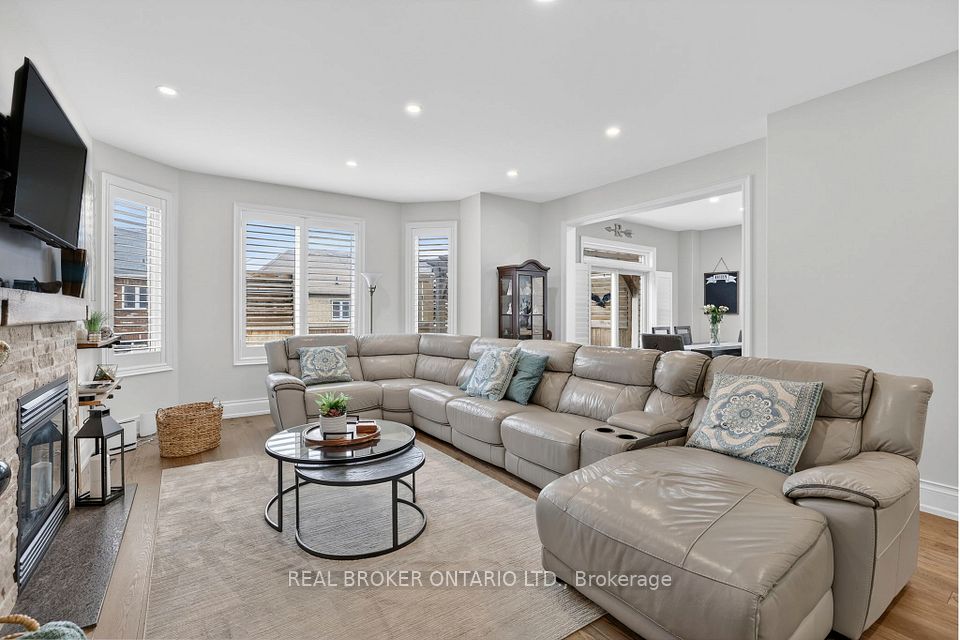 Living Room With Pot Lights & Hardwood Floors