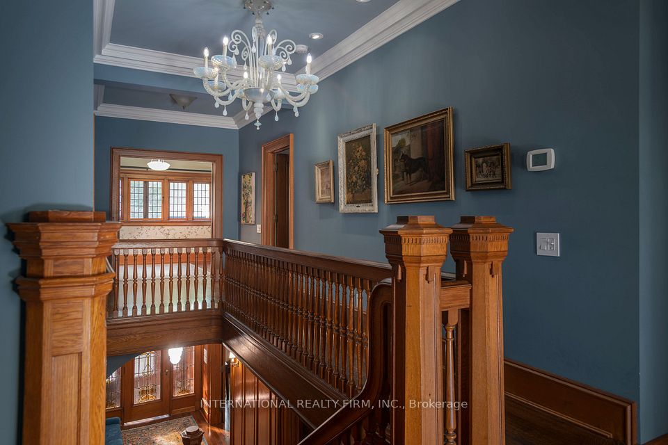 Upper hall illuminated w/ Murano glass chandelier.
