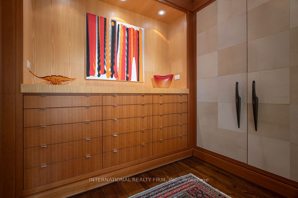 "His" dressing room with double closet and bureau.