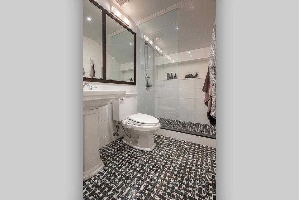 3rd bedroom en suite bath with basketweave tile.