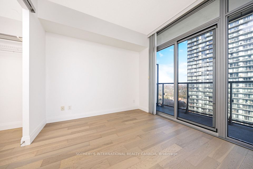 Primary bedroom with sliders to balcony