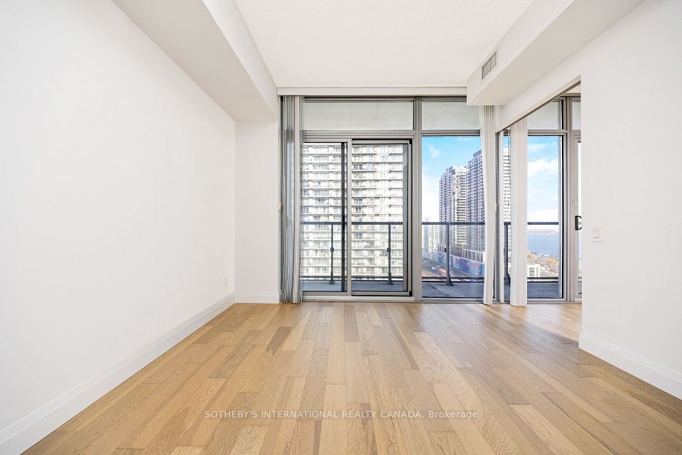 Primary bedroom with sliders to balcony