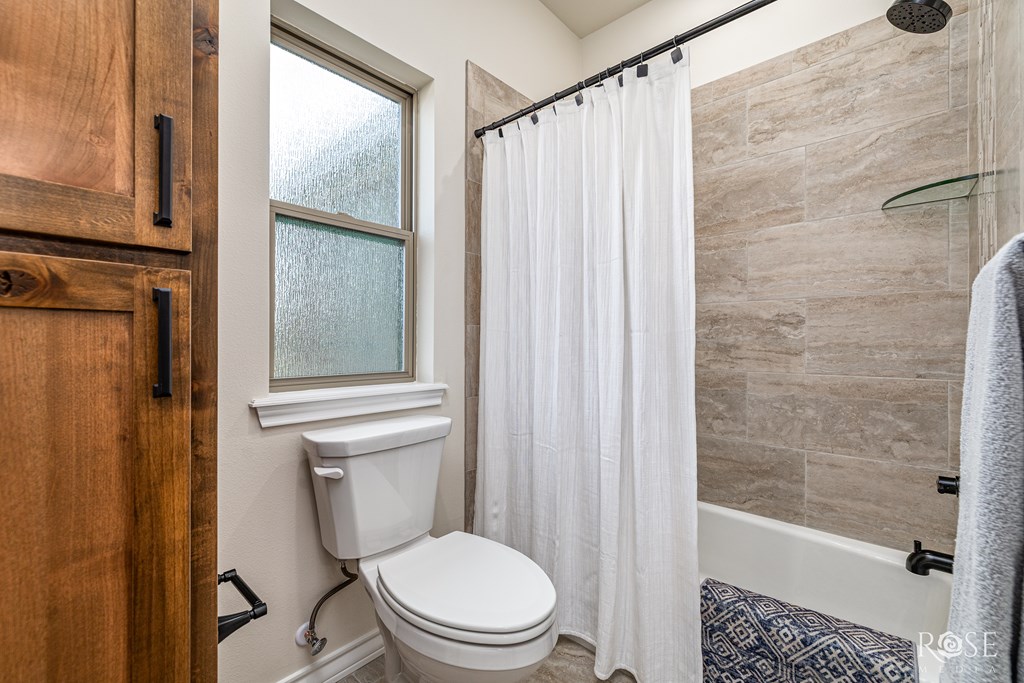Secondary Shower/Bathtub and Toilet Room