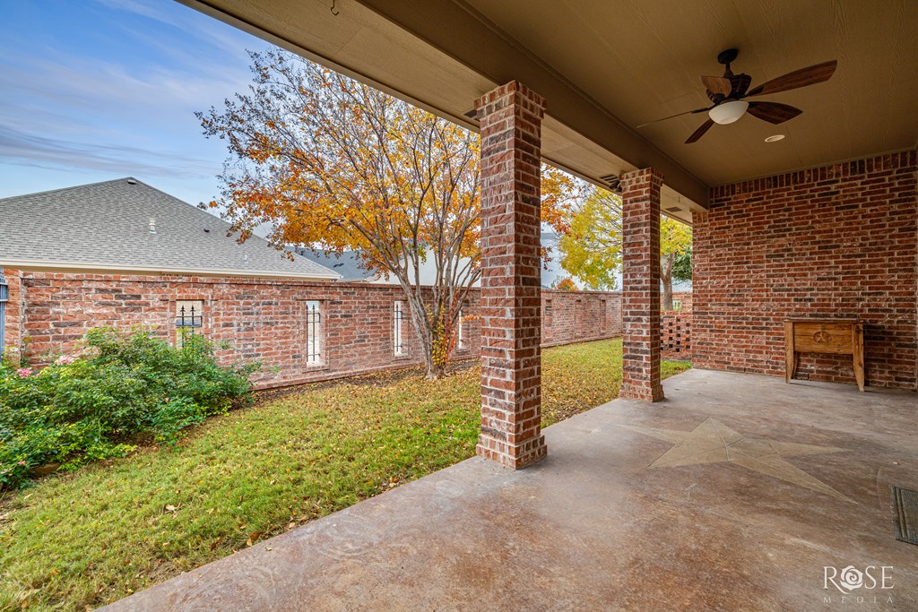 Side Yard with Custom Brick and Iron Fence
