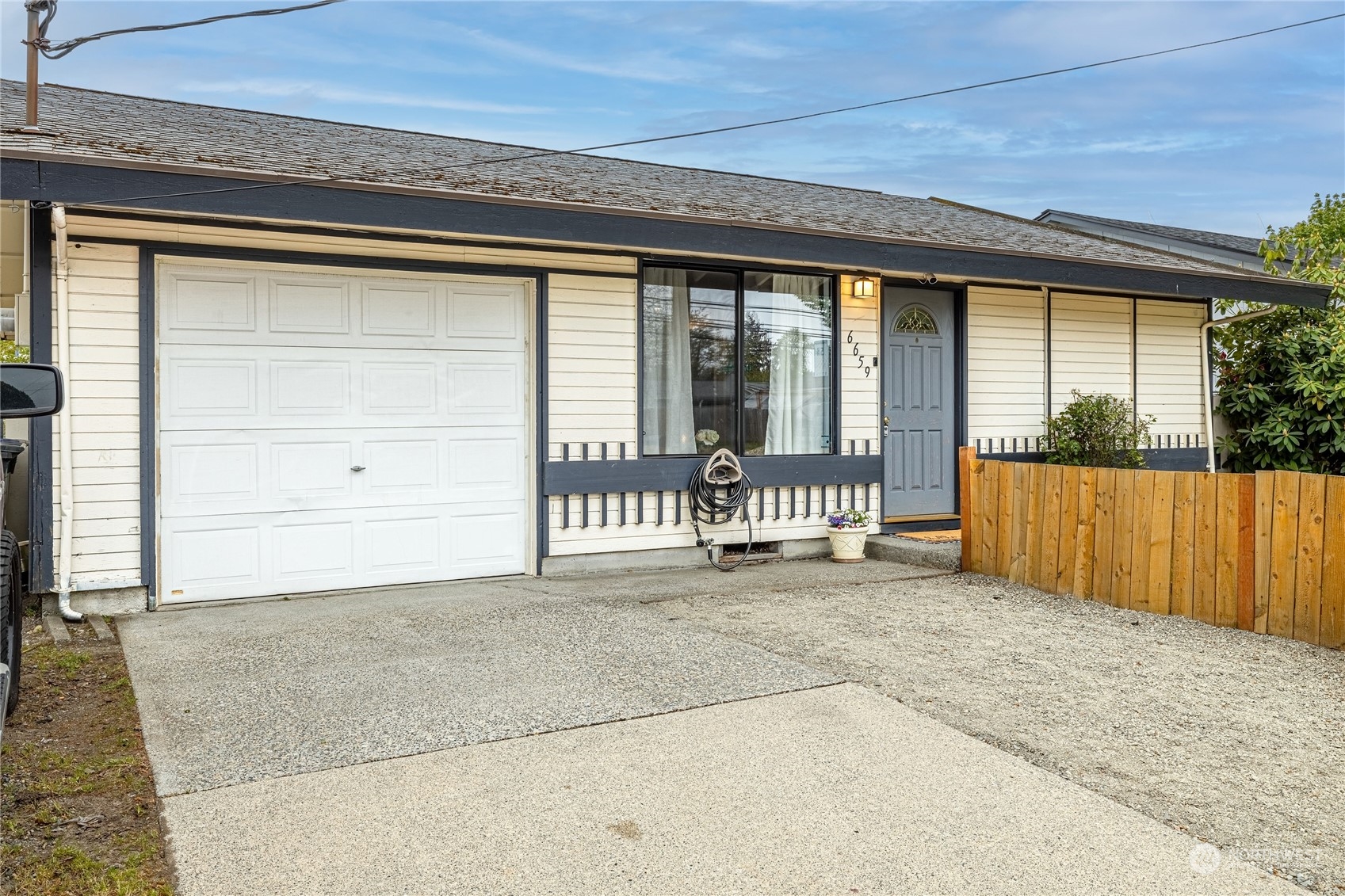 One Car garage with room for three cars to part at the front.