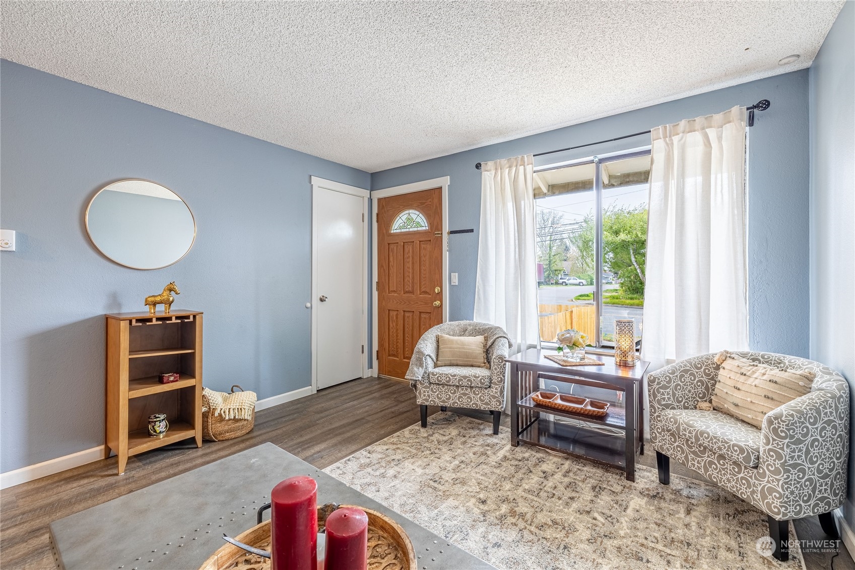 The bright airy living room welcomes you in to this cozy home.