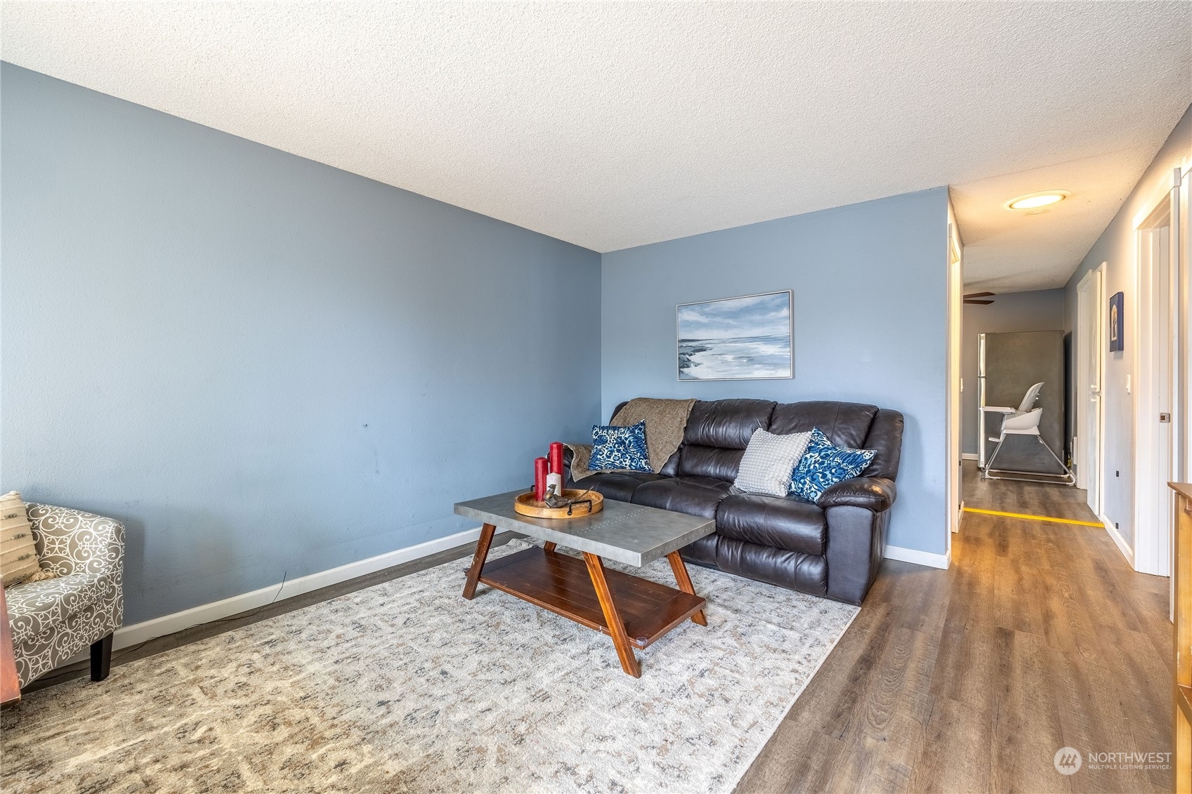 The front room allows for different furniture configurations. Come, see, bring your measuring tape to see how to best fit your furniture.