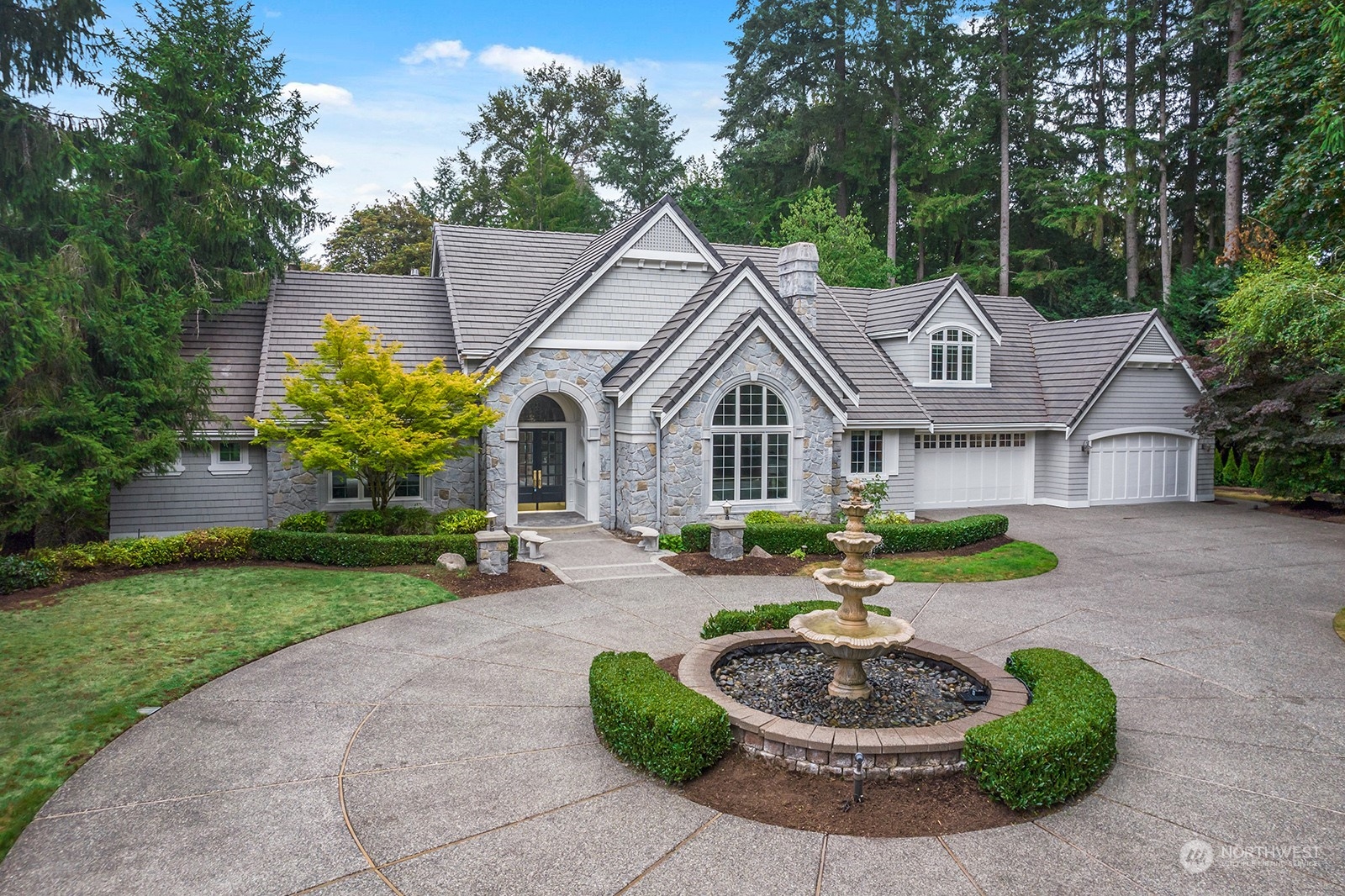 Extraordinary home with stunning circular driveway and lovely water feature! Plus a 4 car garage!