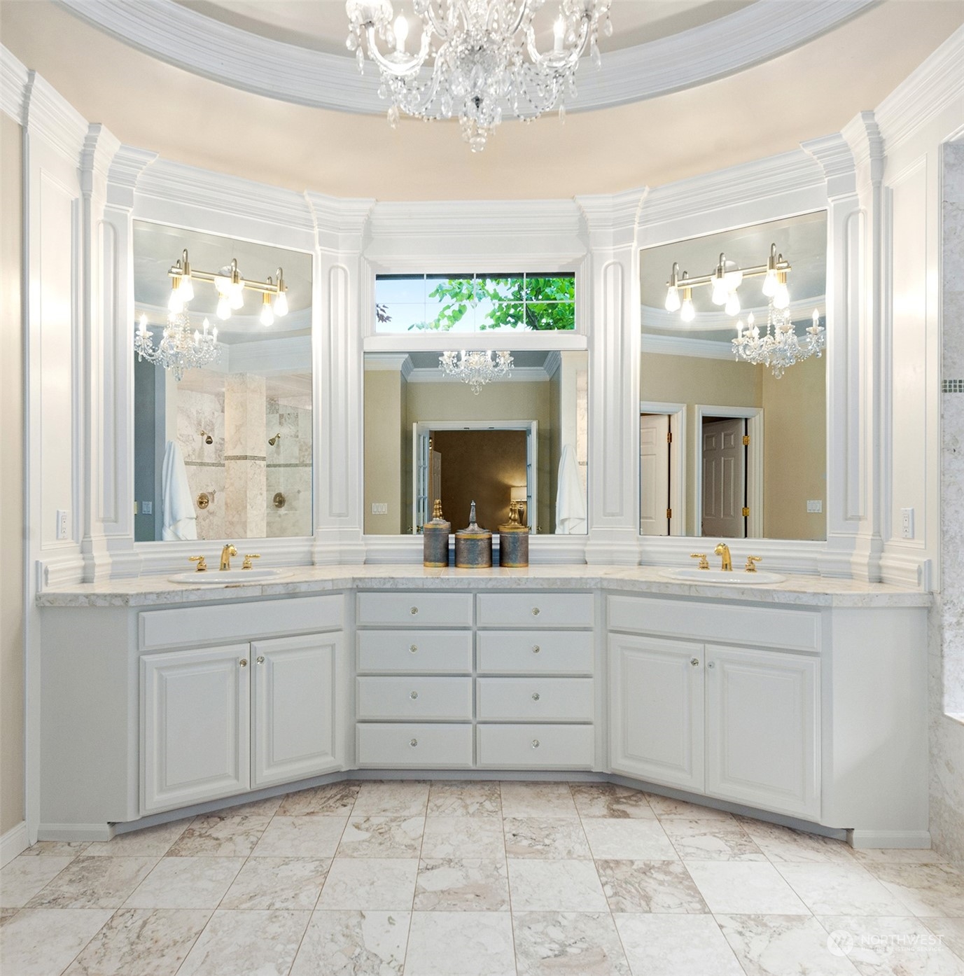 Elegant Primary Bathroom with double vanities and adjacent to the spacious walk-in closet.