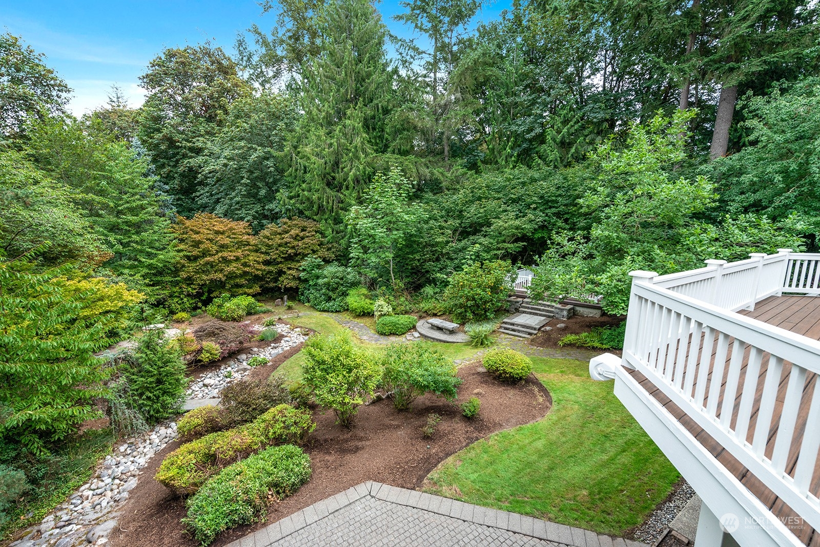 Expansive composite deck along the back of the house! Awe-inspiring private back yard!