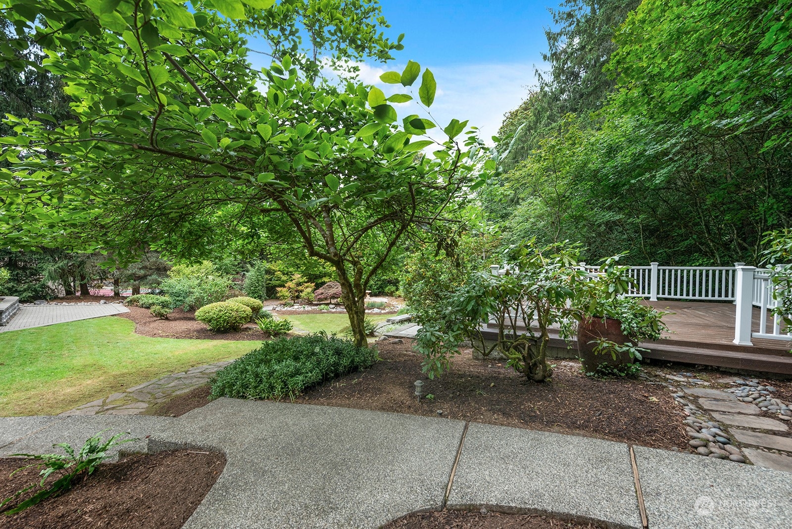 Magnificent landscaping enhances this extraordinary serene back yard! Truly an outdoor paradise!