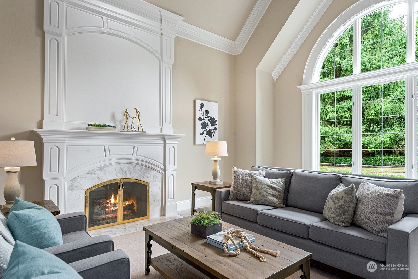 Light filled formal living room with beautiful mill work and a wall of windows.