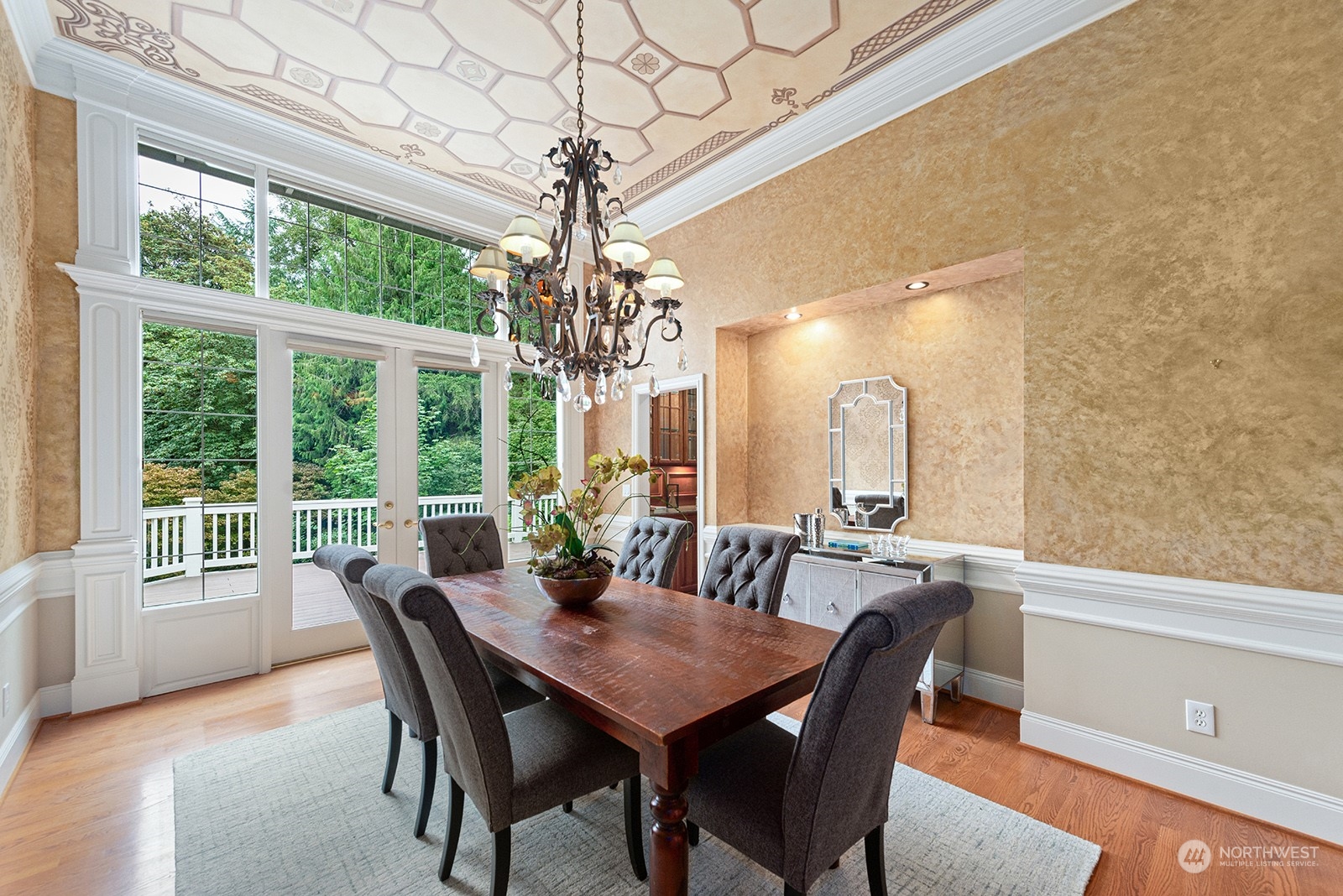 Gorgeous dining room with beautiful detail and finishes. French doors lead to the extraordinary deck.