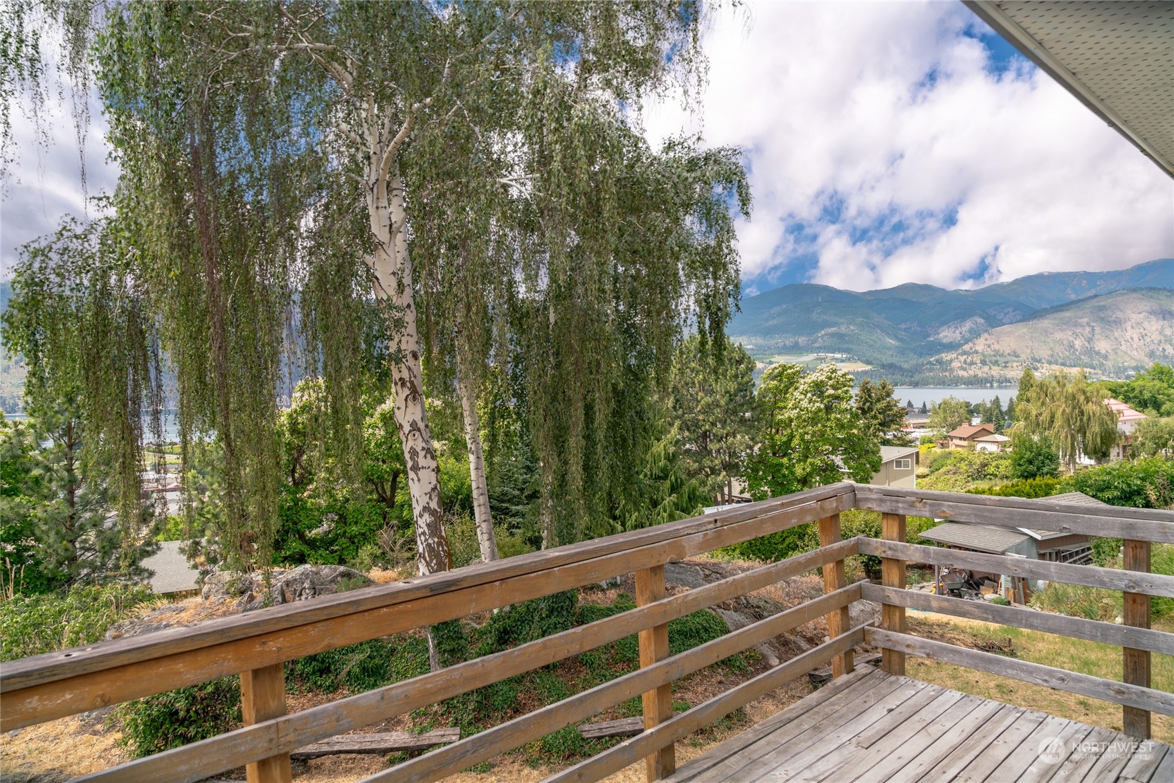 Expansive views of lake and trees offering beautiful gardens