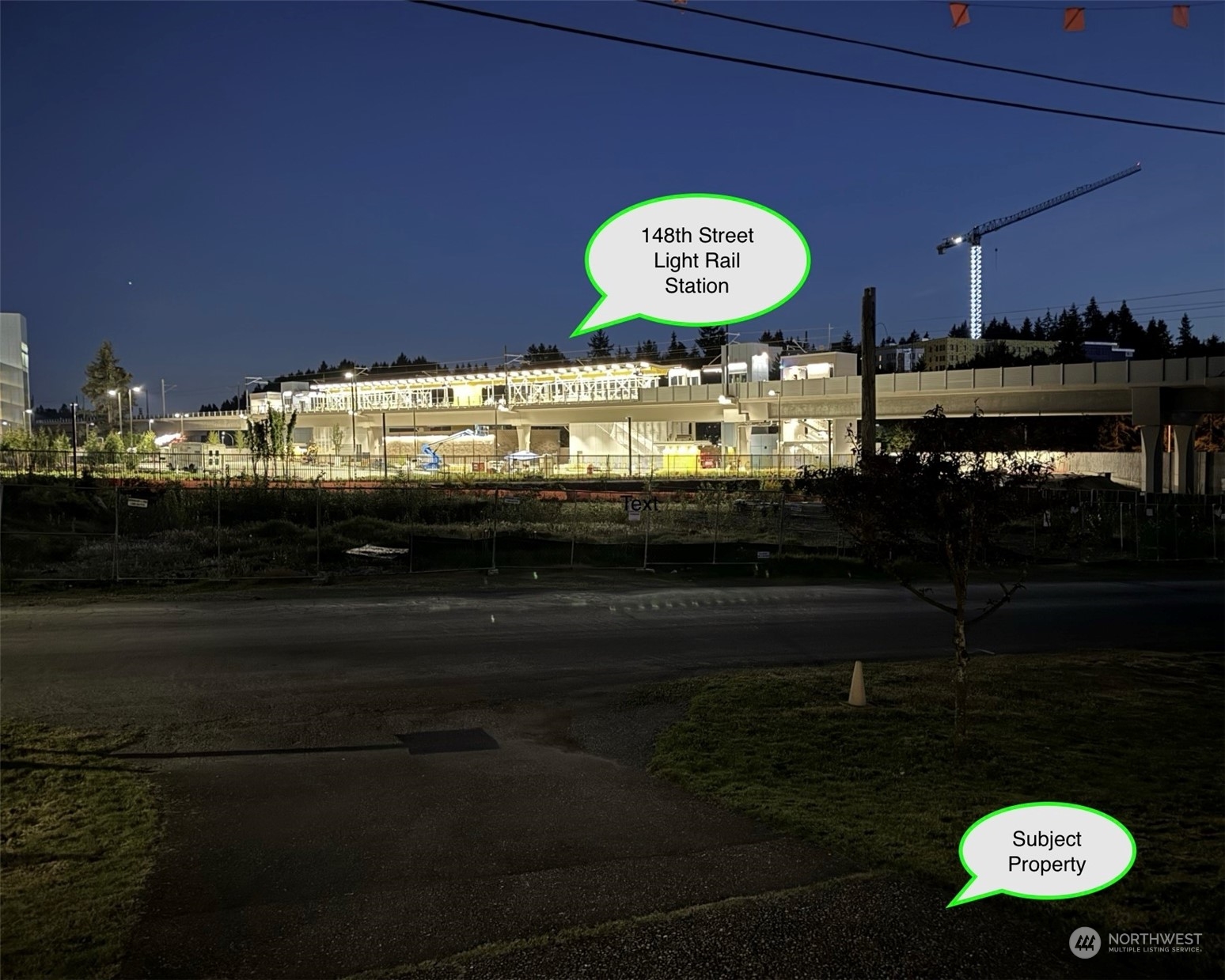 Night time view of the light rail station from front door of home