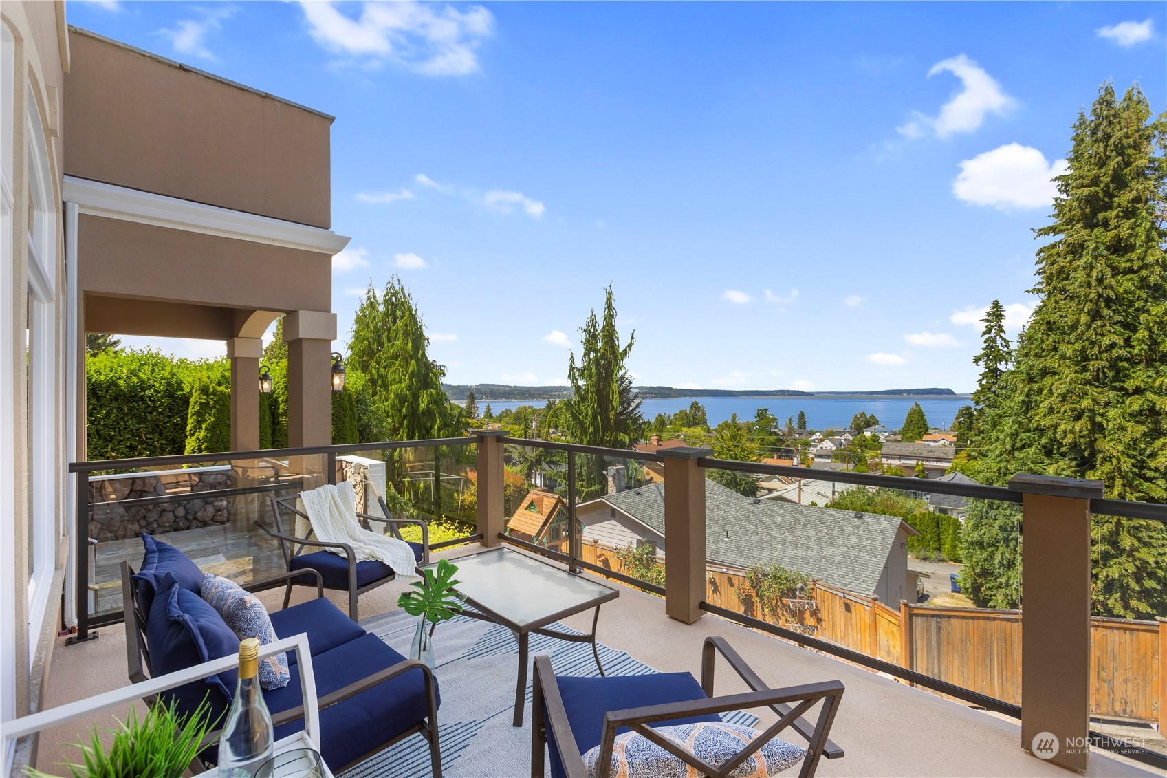 View deck in front of home adjacent to covered deck area.