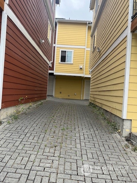 Enter the garage parking area between the buildings