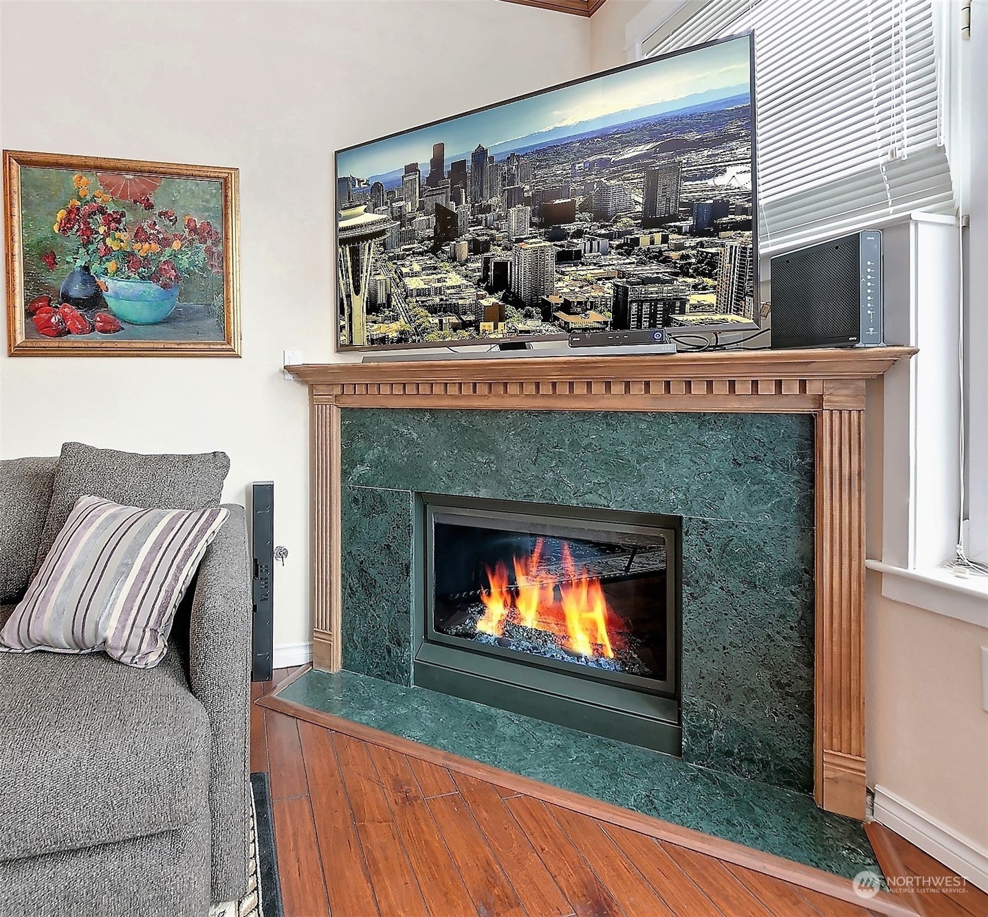 Beautiful marble gas fireplace, new in 2014 includes a built in light show. The custom mantel piece easily houses a 65 inch TV with plenty of room behind for components. The fireplace features a remote thermostat that keeps the room at your set temperature.