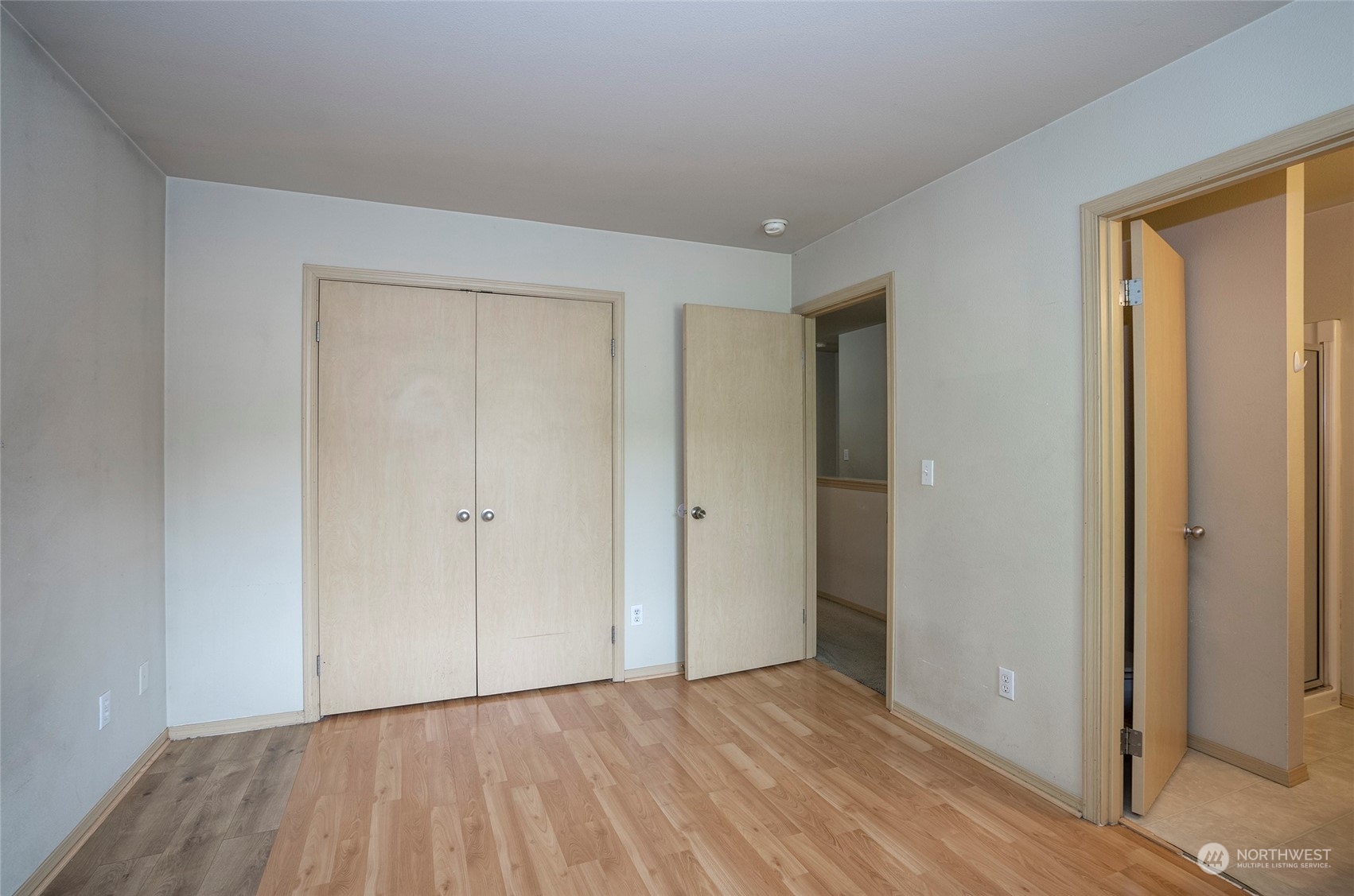 The primary suite includes a double-door closet for ample storage.