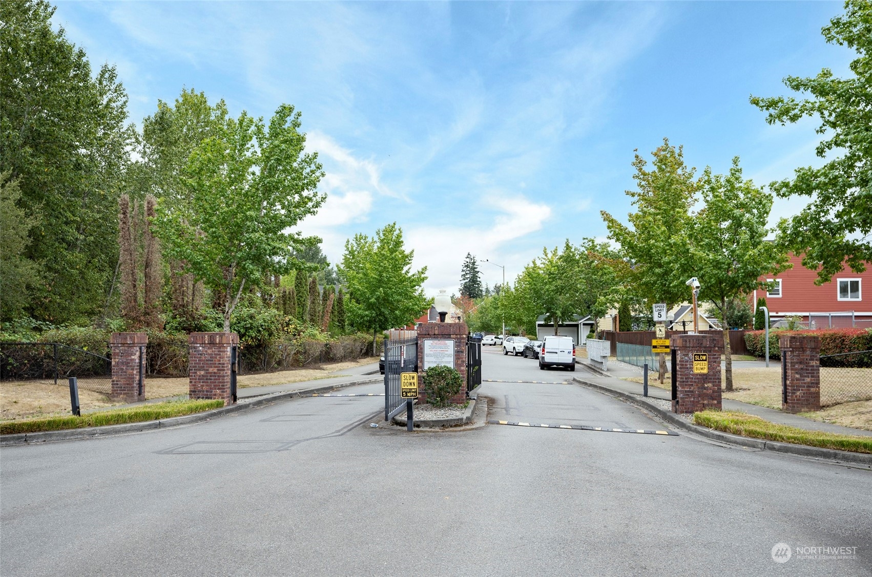 The Village Commons community features a gated entry, along with a clubhouse and playground.