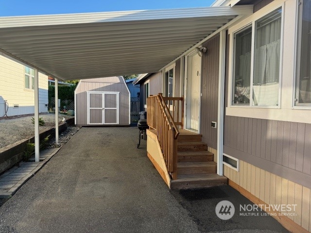 Large carport for two vehicles.