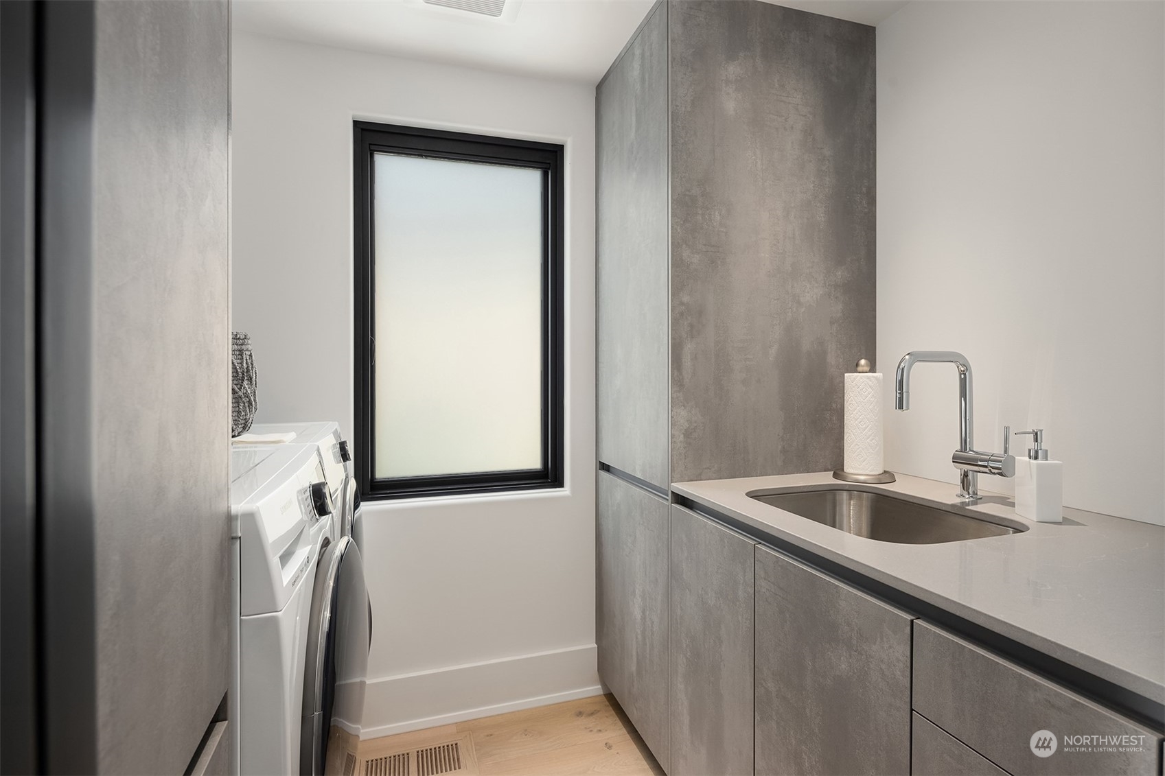 Second floor utility room which is one of three in the entire property.