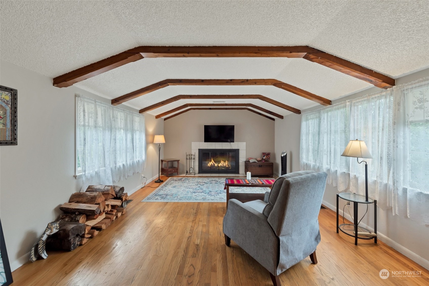 Wood beam ceiling, cozy wood fireplace