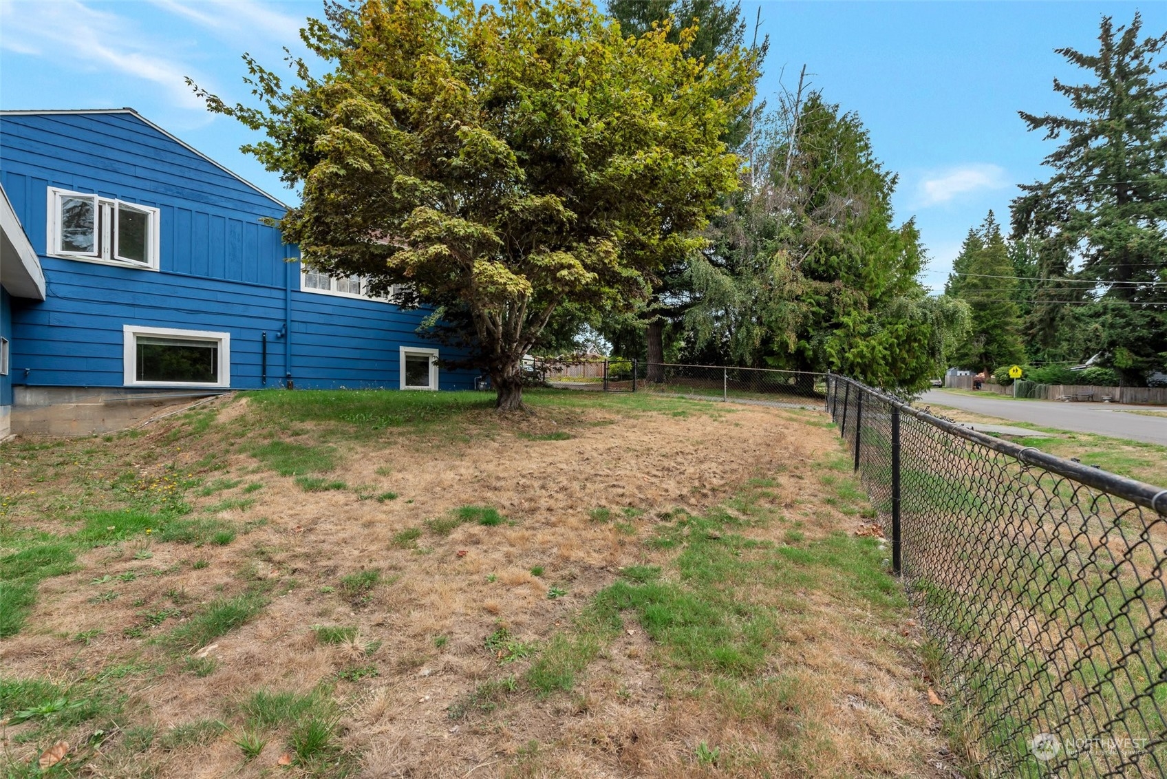 Fenced sideyard near garage