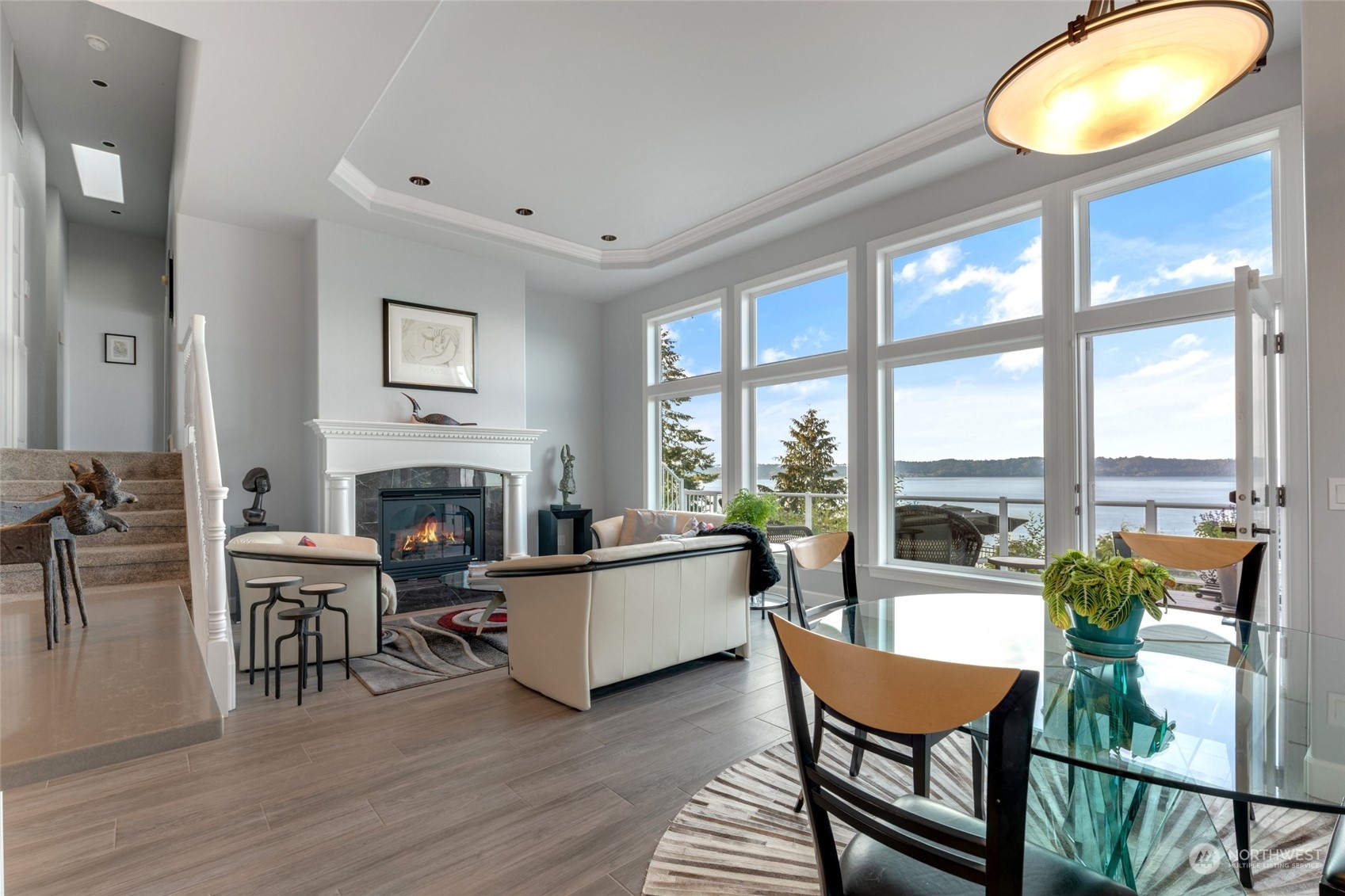 Relax by the cozy gas fireplace while taking in breathtaking views from the comfort of your living room.