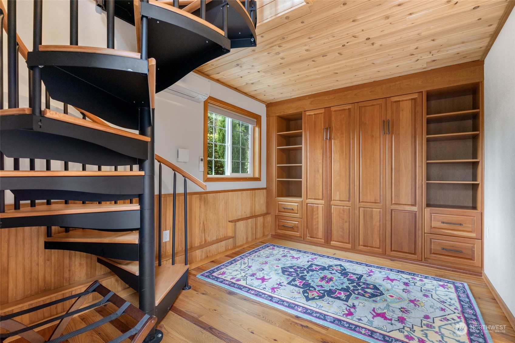 Detached guest house features a Murphy bed, full bathroom, and kitchenette downstairs, along with a beautiful office space upstairs complete with built-in cabinets. A perfect blend of comfort and functionality for guests or as a home office