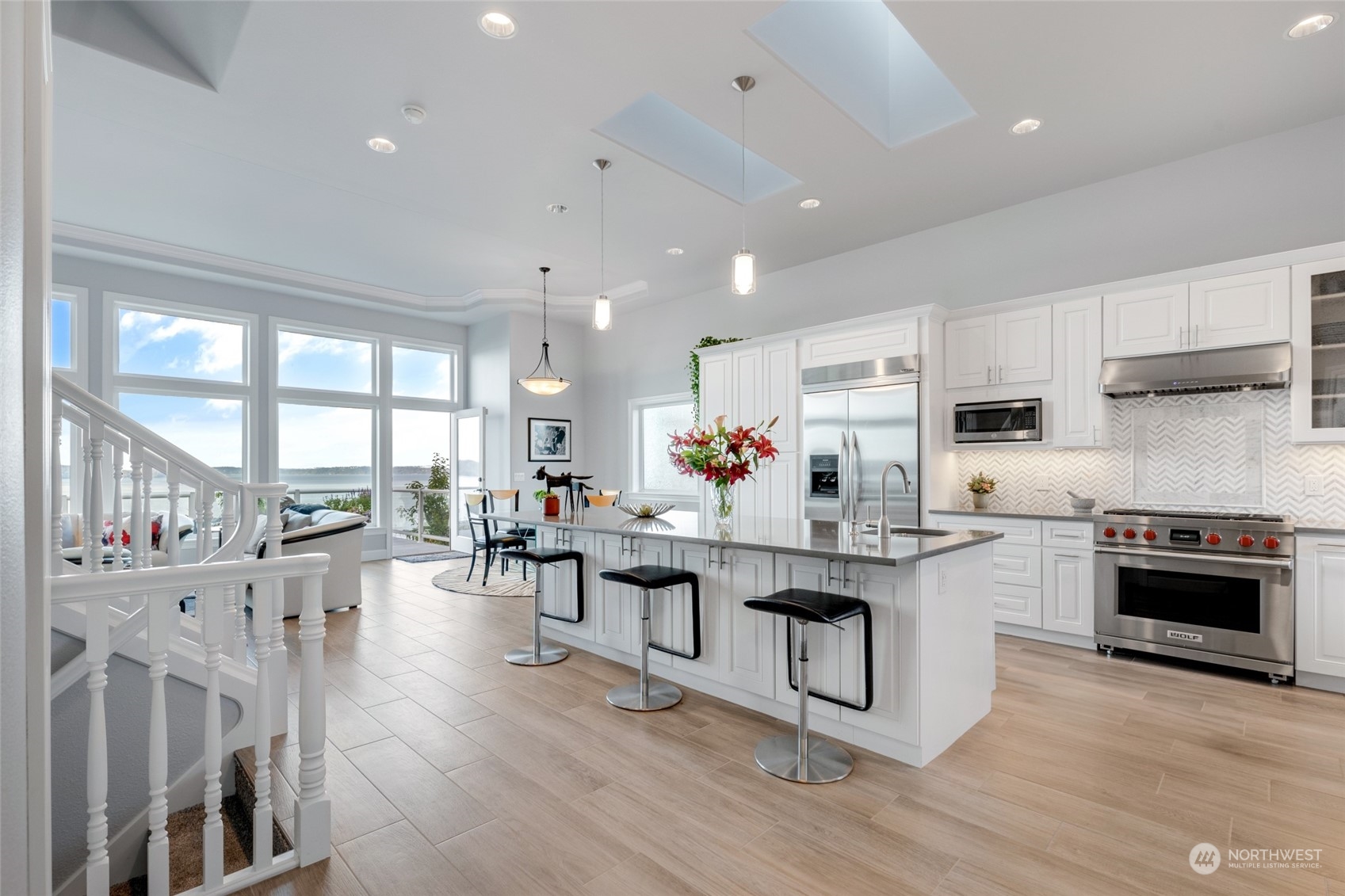 Featuring high-end kitchen appliances, including a Wolf range, this kitchen is a chef’s dream for both culinary adventures and elegant entertaining