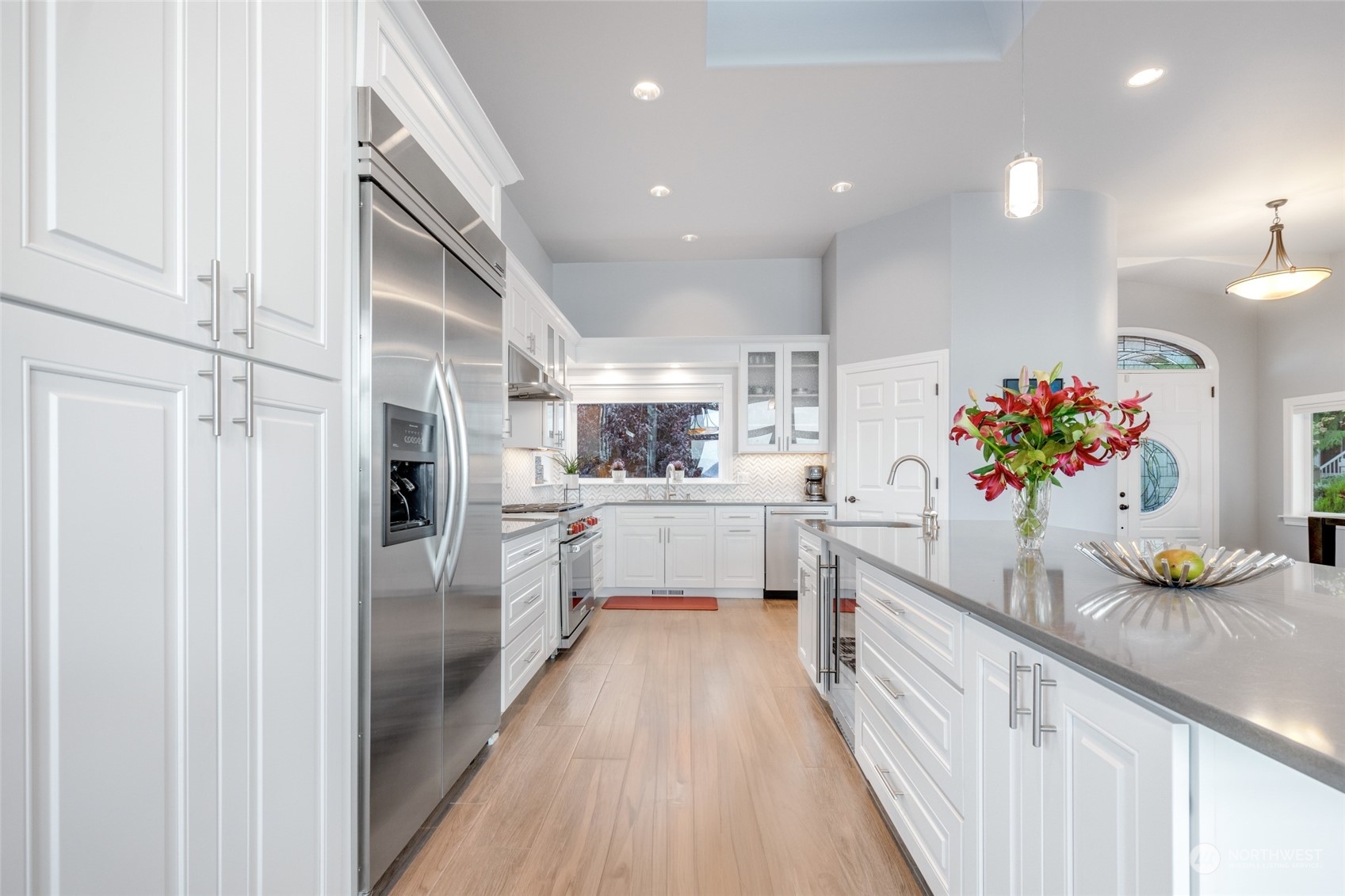 Entertain in style in this stunning chef's kitchen, featuring a massive island perfect for gatherings and gourmet creations.