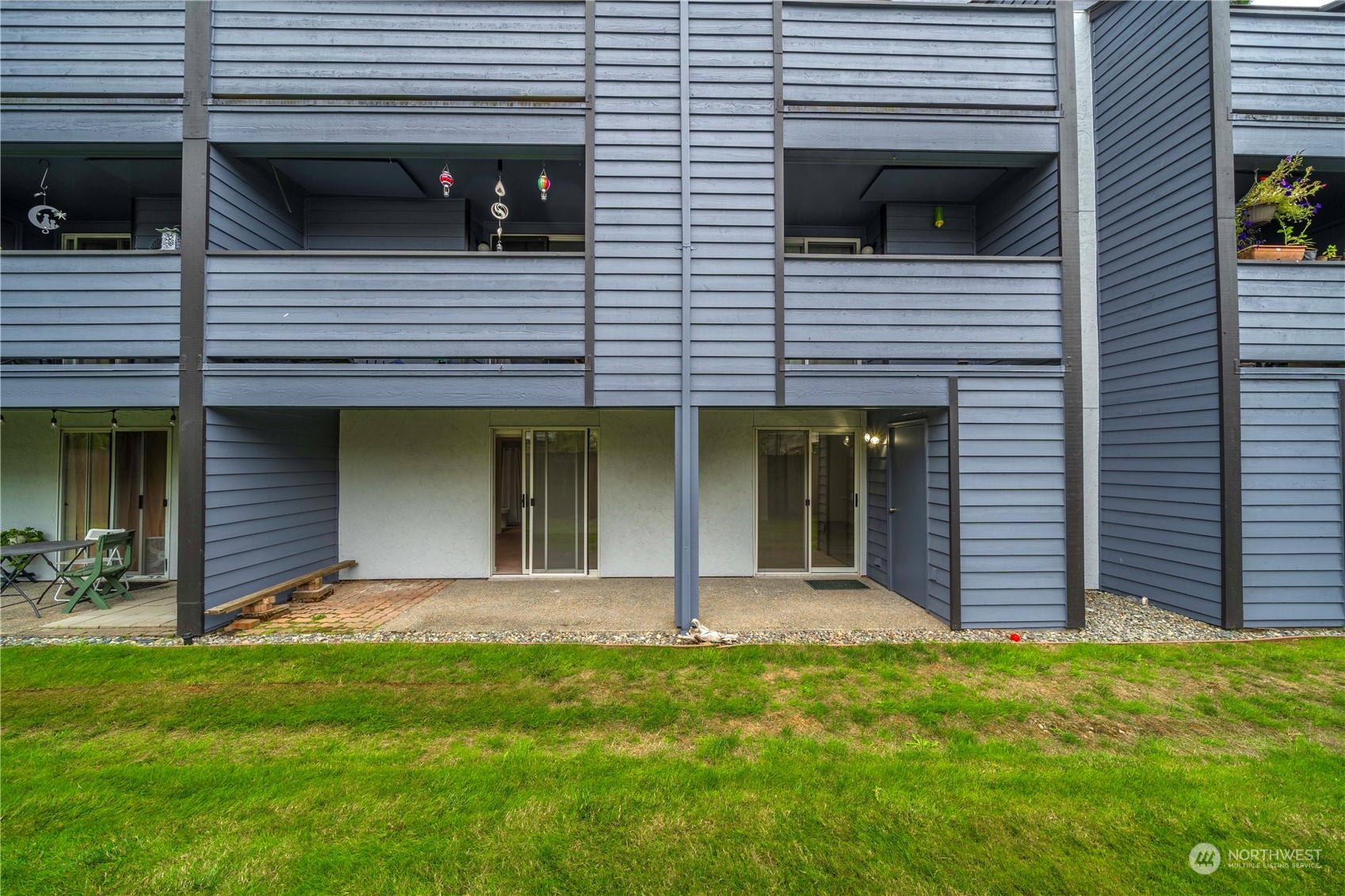 Ground Floor Back Patio: Left Sider lead to Primary Bedroom, Right Slider leads to Great Room