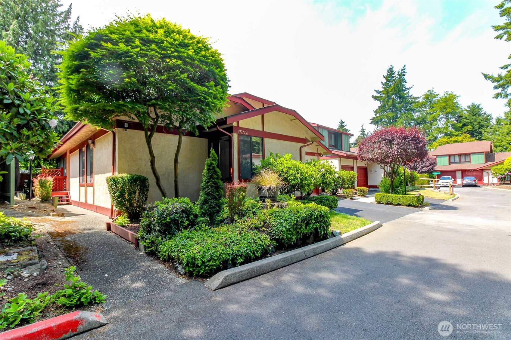 As you approach the home, you will see the front walkway first and on the right side of the unit is the garage with driveway parking.