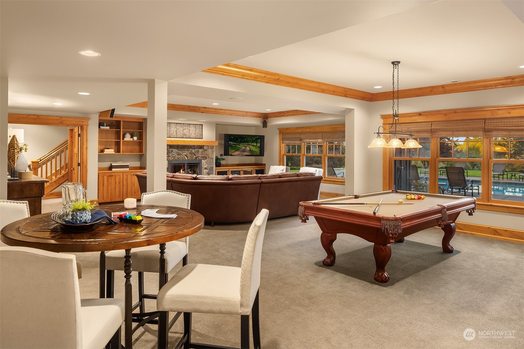 Covered porch off of the kitchen with terraced views of the property