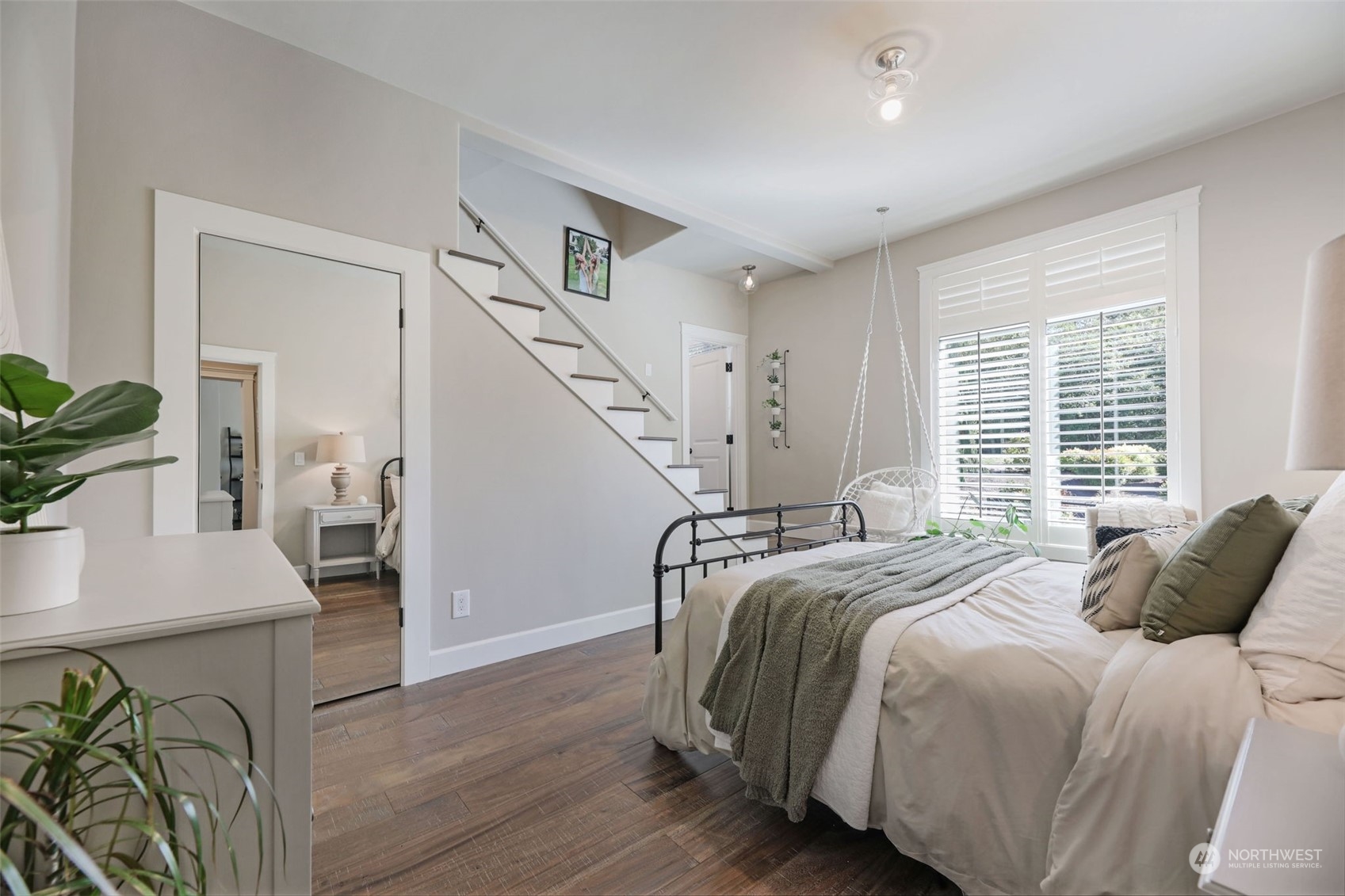 Bedroom #2 with a large en-suite bath & walk-in closet. Steps leading to the open loft area with skylights.