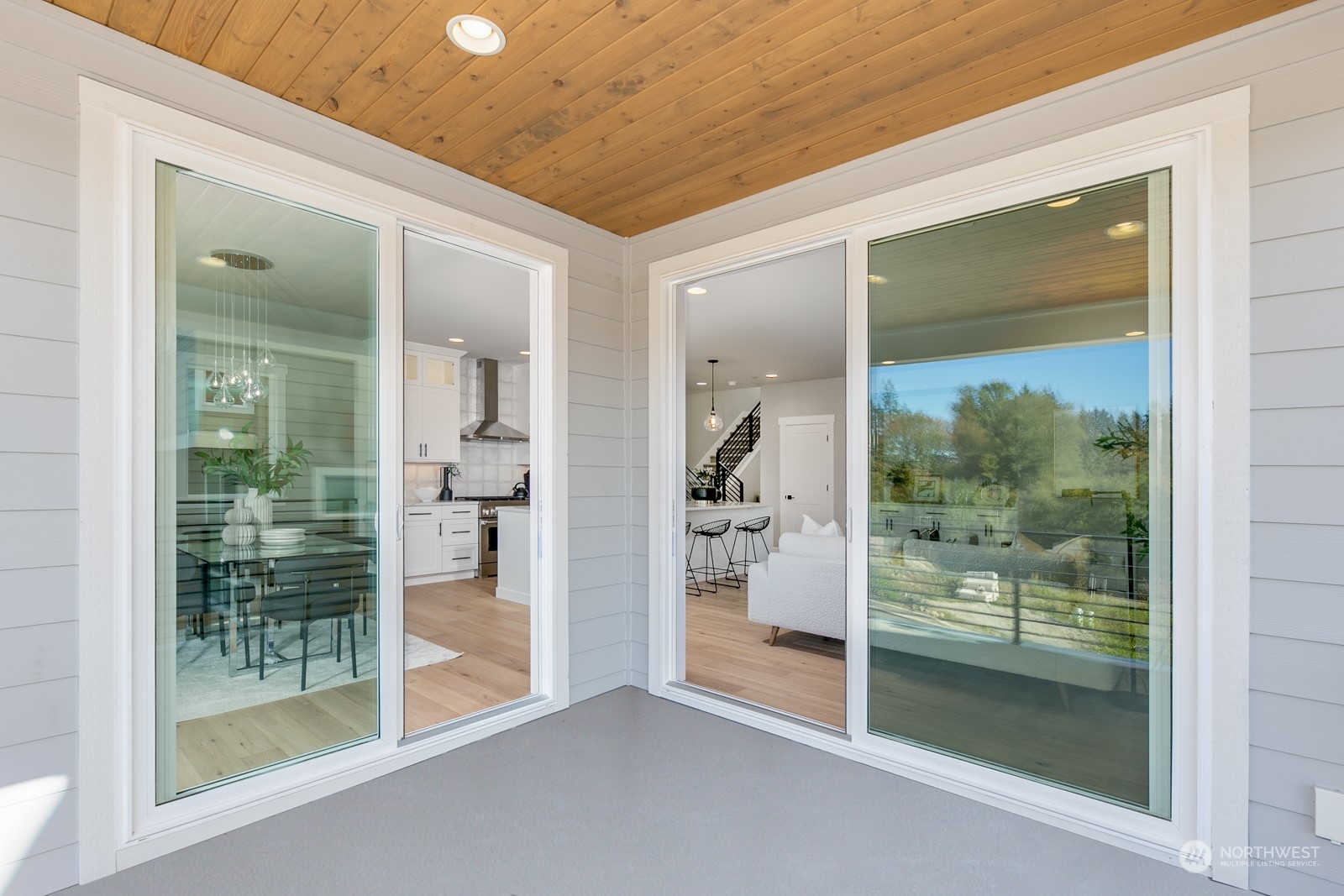 Light-filled Dining Room with sliding door to the covered deck.